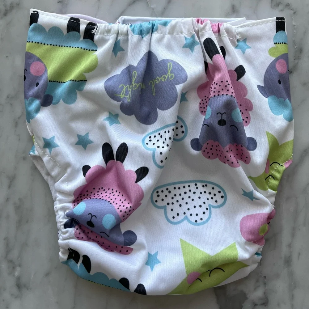 Adjustable, vinyl, disposable diapers with carry bag. Inserts bought separately.